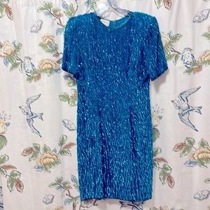Sequined cocktail dress. Turquoise with black trim